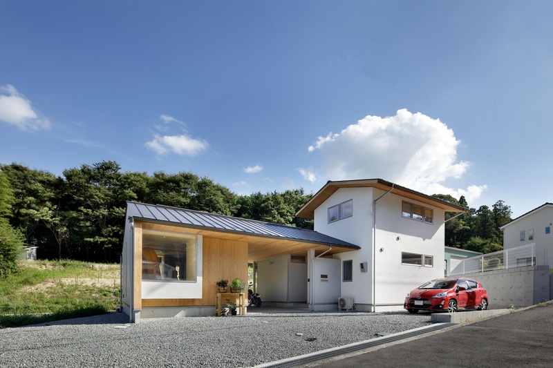 折れ曲がった家